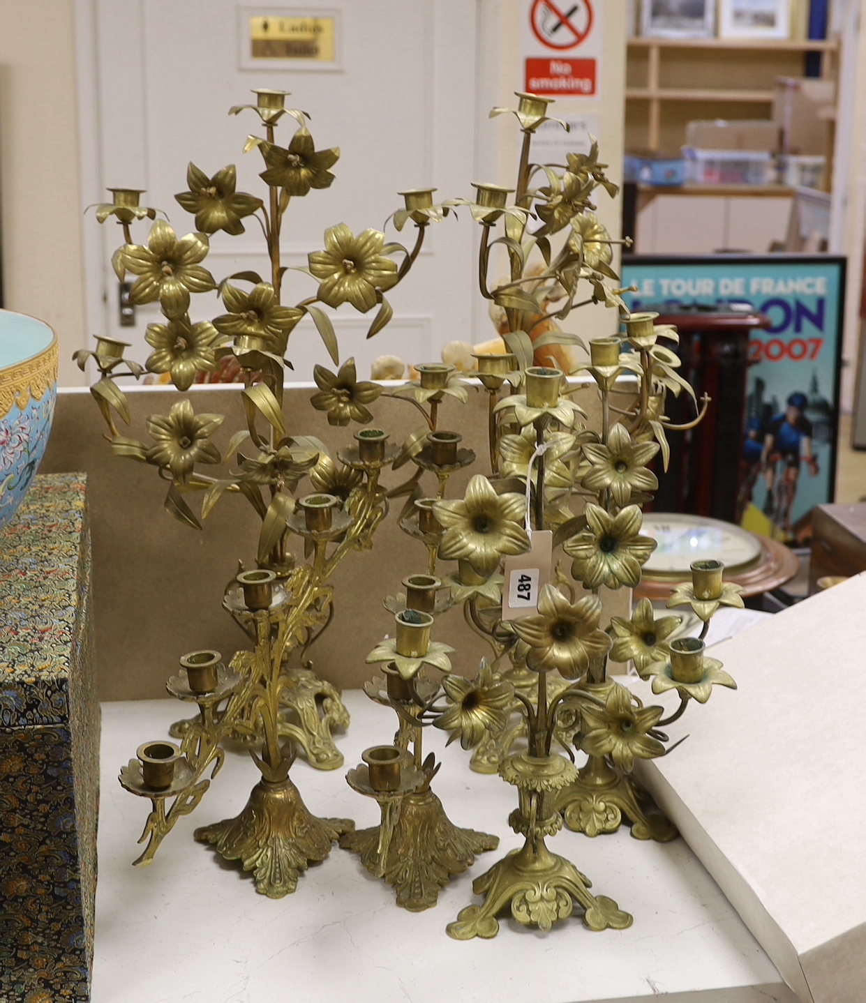 Three pairs of brass plant form candlestands / candelabra